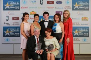 Ray McCaughey (front left) is pictured with his family at the Ireland's Forecourt & Convenience Awards in Dublin on Thursday September 15. 