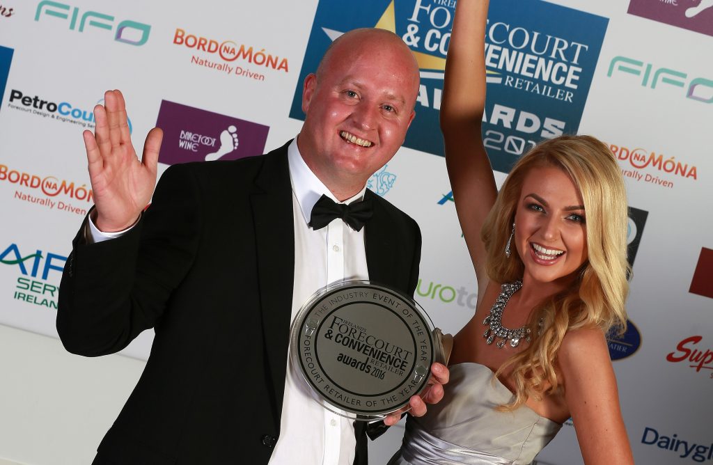 Maxol M3 Mulhuddart store manager Keith Doyle celebrates winning Forecourt Retailer of the Year with model Meagan Green